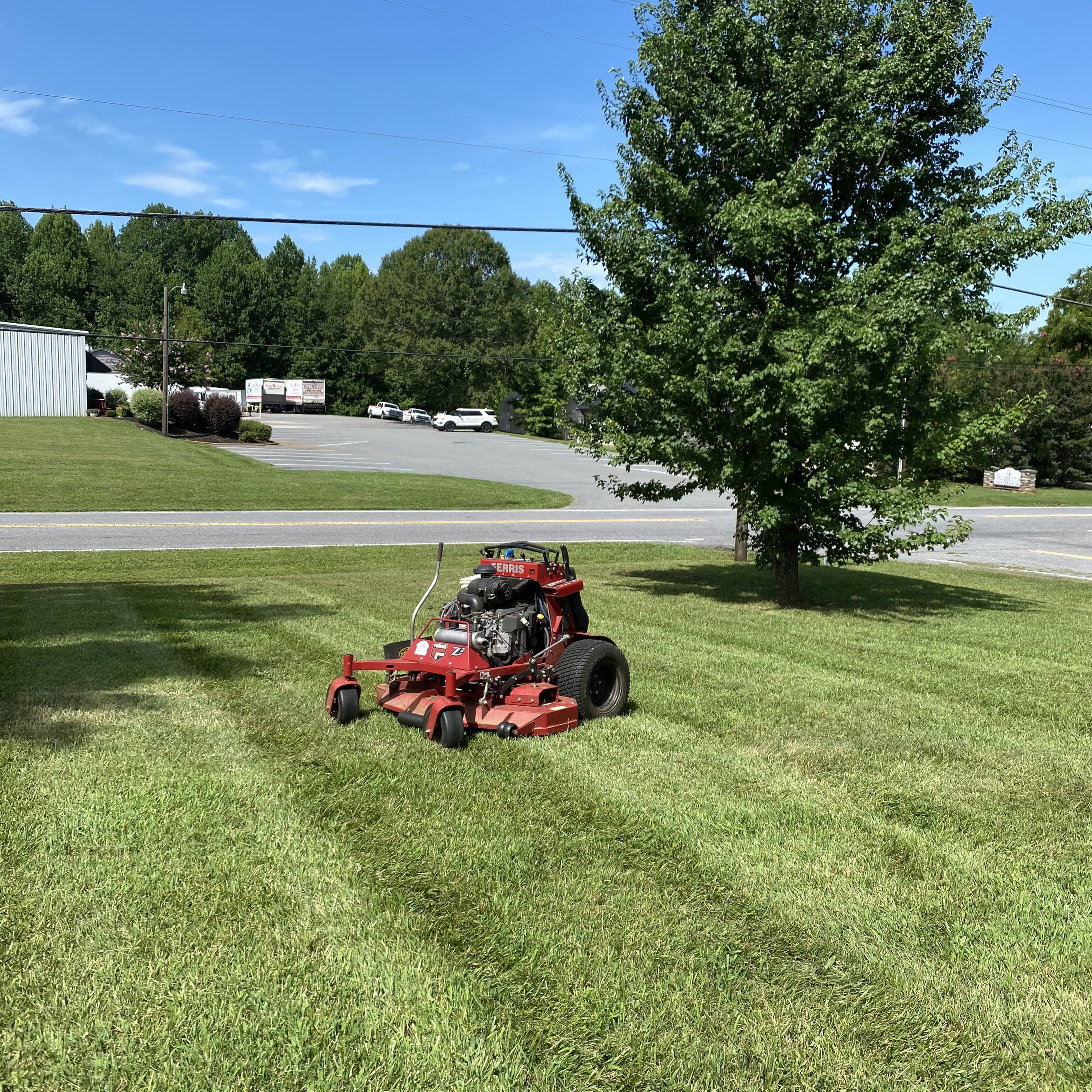 EST Landscape mowing equipment on a freshly cut lawn